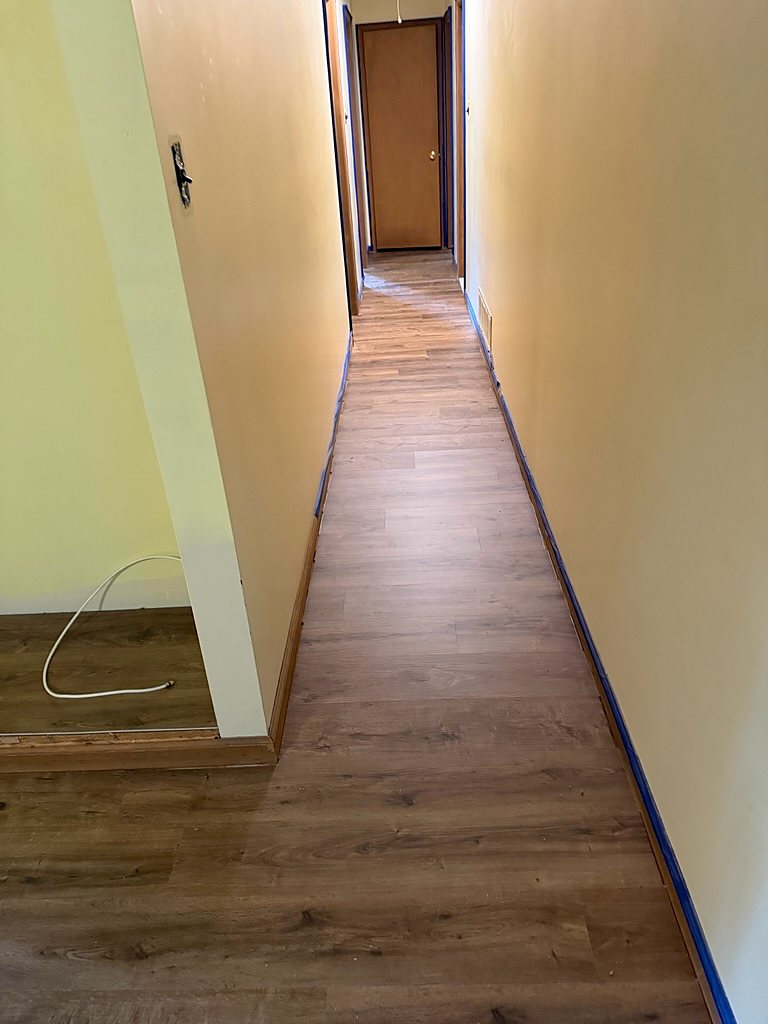 Ewing, NJ: The hallway, plank running its full length, an RJ Laminates installation
