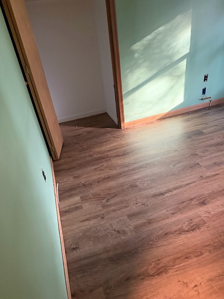 Ewing, NJ: Bedroom into the closet, one continuous run, an RJ Laminates installation