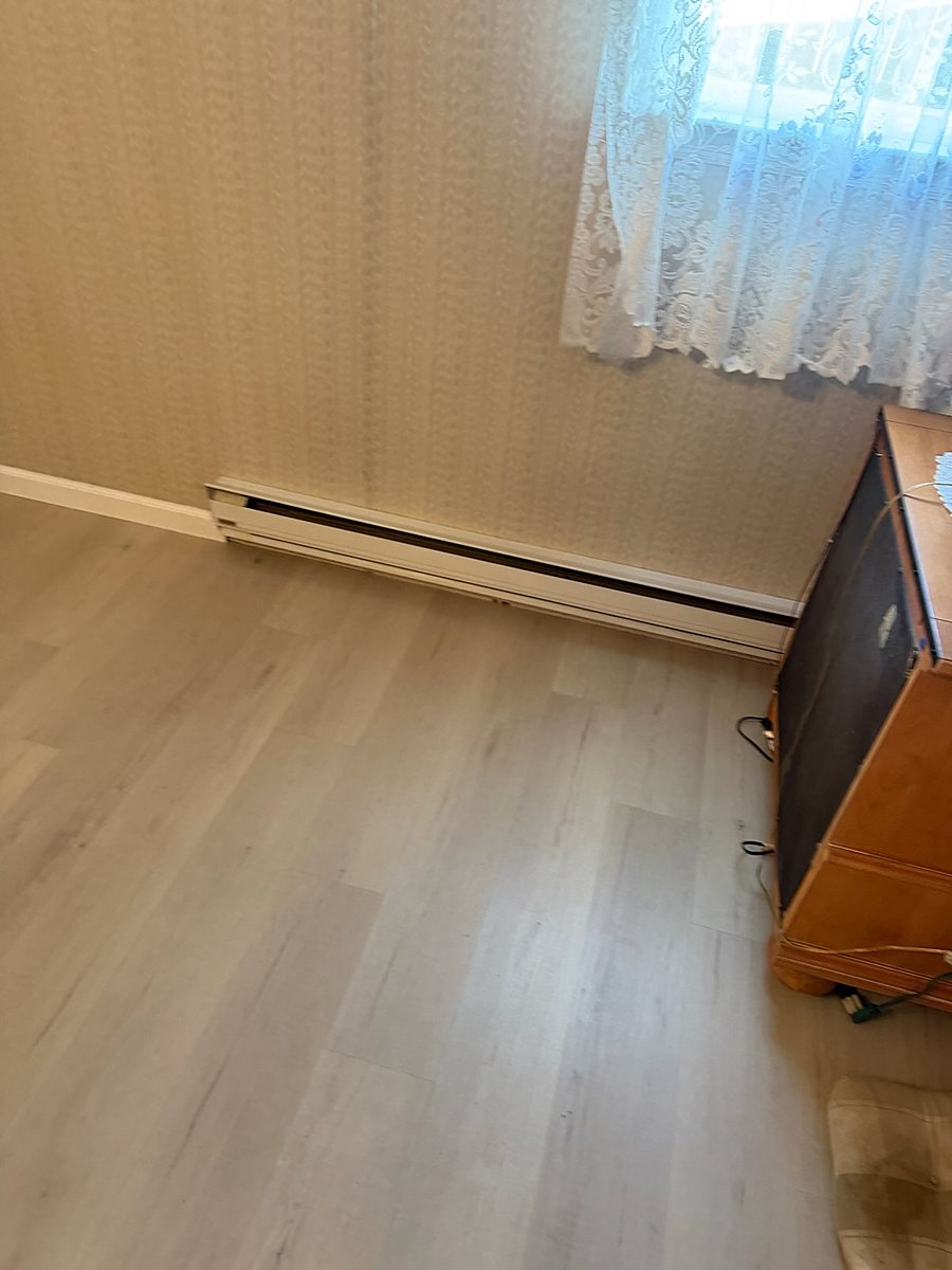 Hamilton, NJ: Run tight under the baseboard heat, an RJ Laminates installation